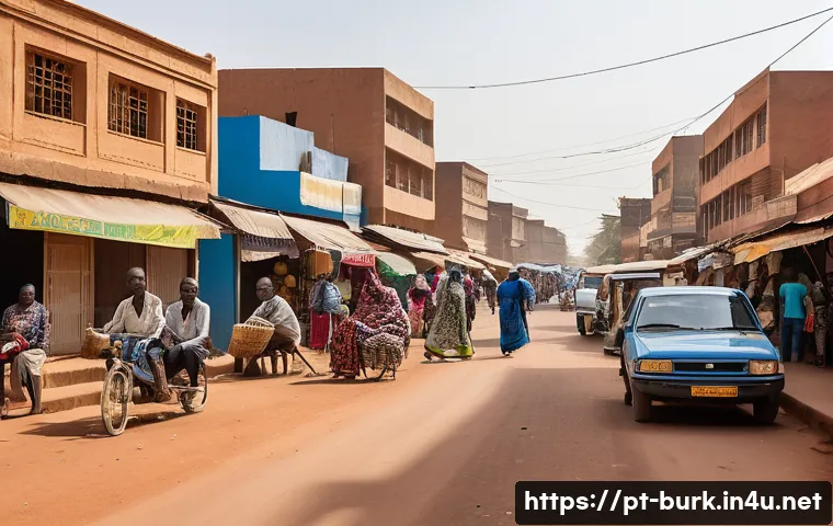 부르키나파소에서 살기 좋은 지역 및 이민 정보 - A vibrant street scene in Ouagadougou, Burkina Faso’s capital, showcasing a bustling urban environme...